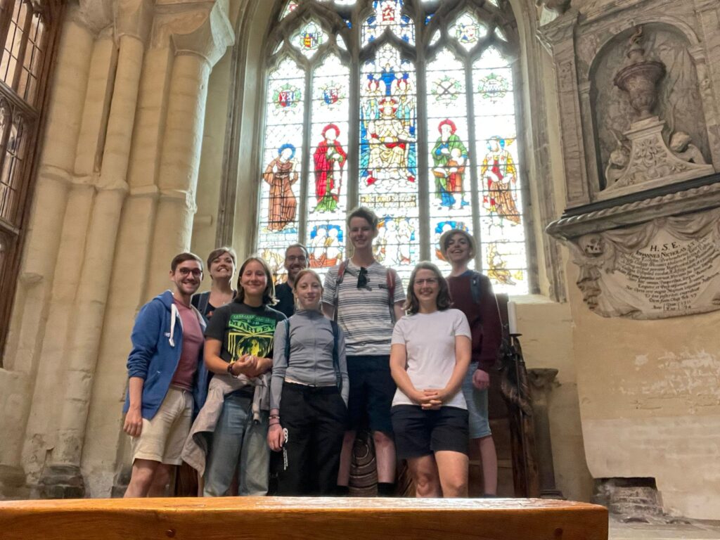 Pilgrimage group standing in front of St Wildred's window in Winchester Cathedral